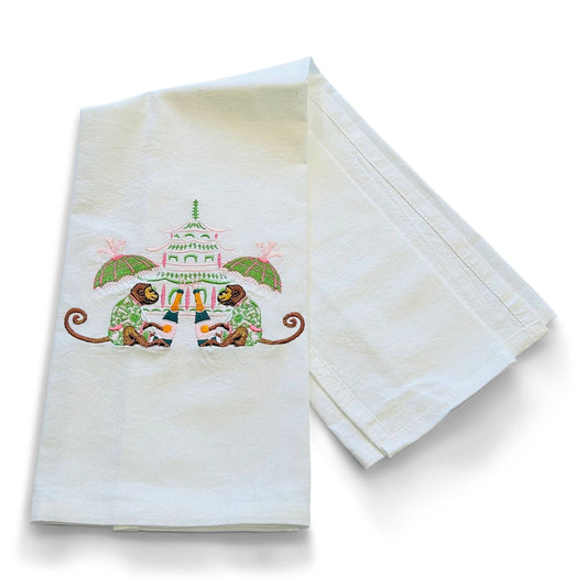 Set of two embroidered towels with a decorative design on a white background