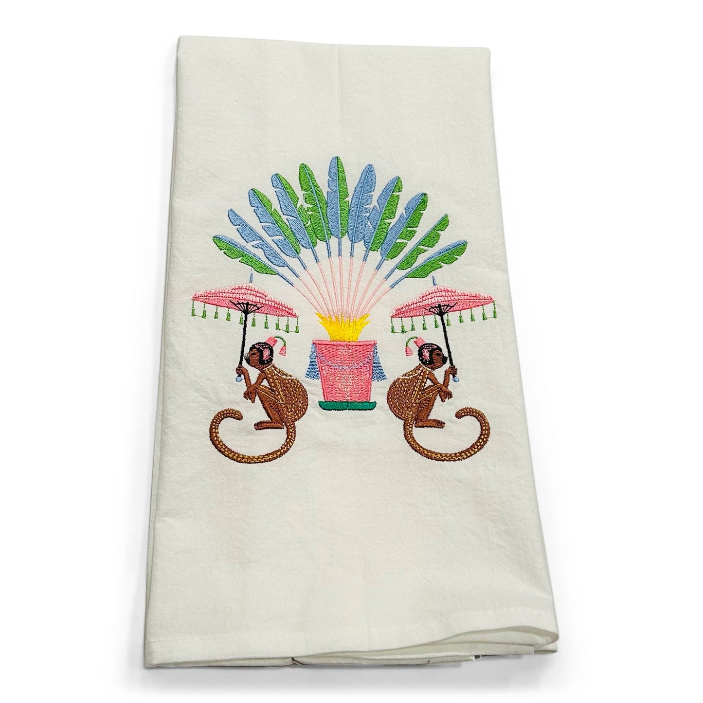 Embroidered towel with monkeys and a fan design on a white background