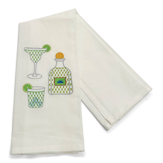 White towels with cocktail-themed designs on a white background