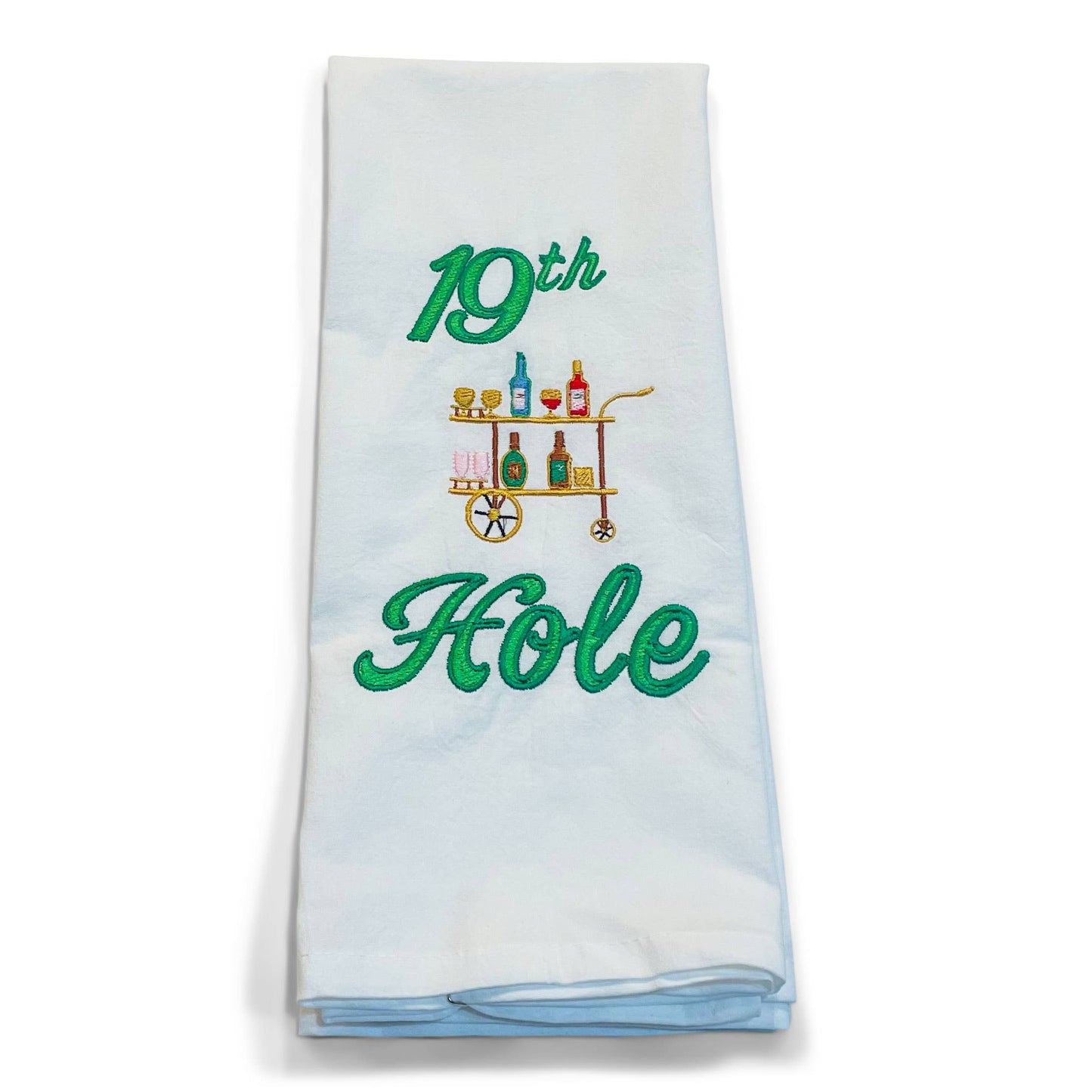White towel with '19th Hole' embroidery and bar cart design on a white background