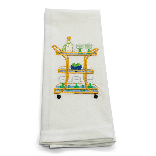White towel with a bar cart embroidery design on a white background