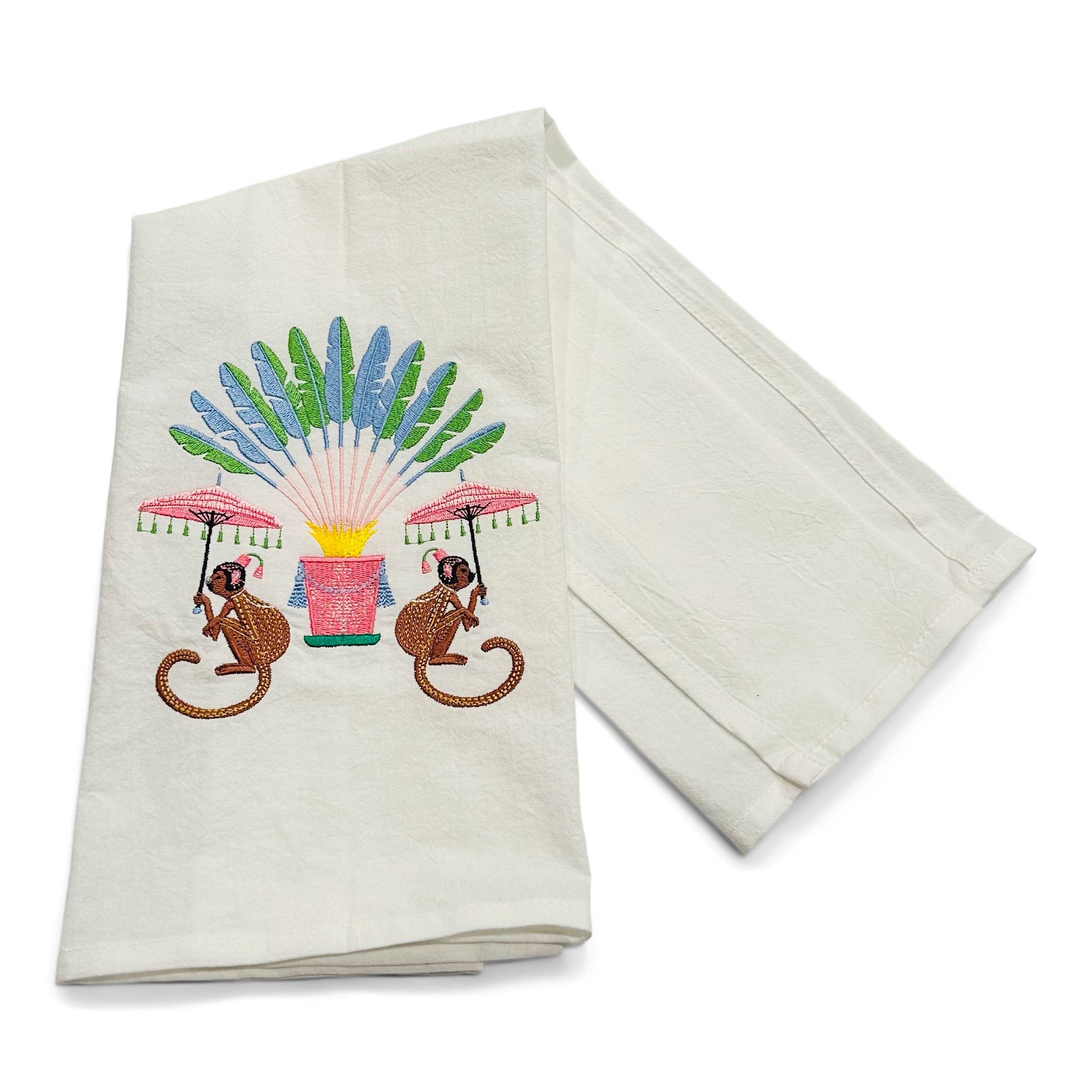 Set of two embroidered towels with monkeys and fans design on a white background
